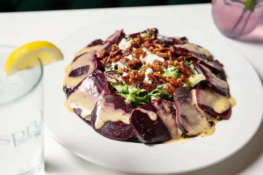 Roasted beet salad with feta, candied pecans, and a creamy dressing