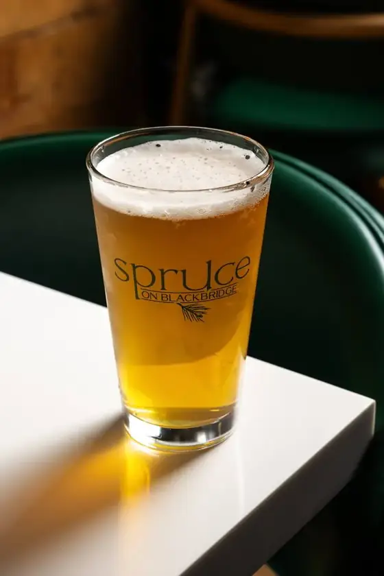 A pint of beer in a Spruce on Blackbridge glass